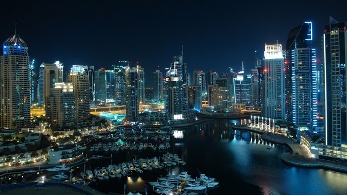 Dubai Marina skyscrapers and yachts at night