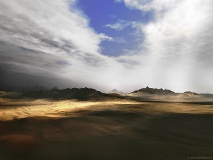 Sunlight over a desert landscape with mountains and clouds