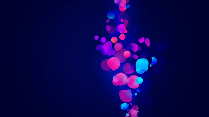 Abstract colorful bokeh lights on dark blue background