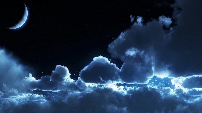 Night sky with crescent moon and clouds