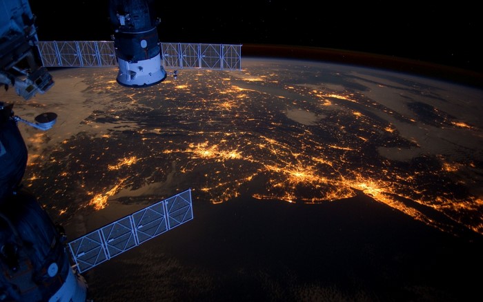 Earth at night from space with ISS modules