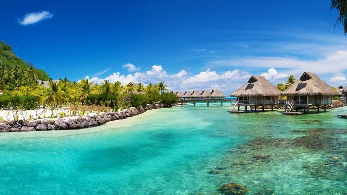 Overwater bungalows in a tropical lagoon