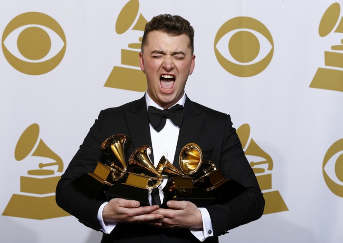Sam Smith holding Grammy Awards