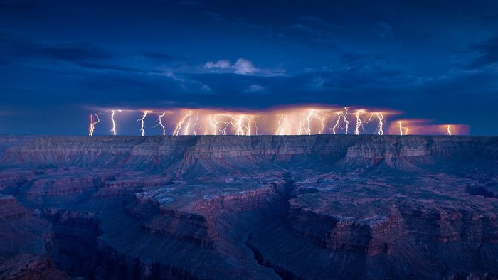 Lightning strikes over the Grand Canyon at dusk