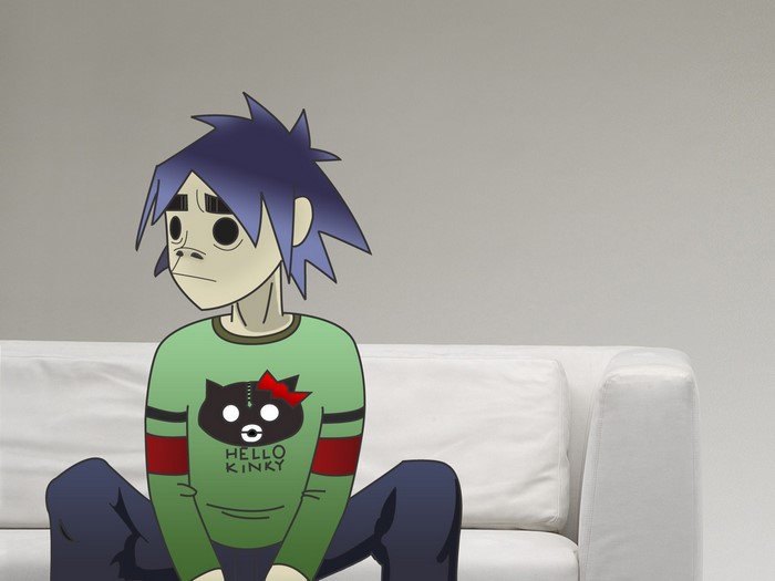 2-D from Gorillaz sitting on a couch