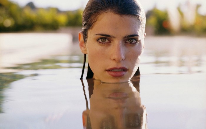 Woman emerging from water