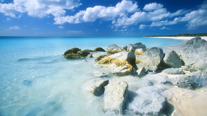Rocky beach with turquoise water and blue sky
