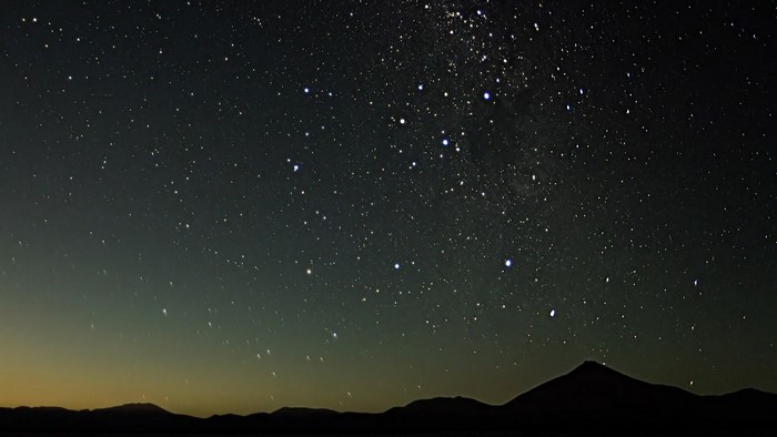 Night sky with stars and mountains