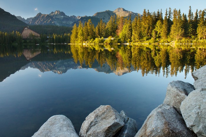 Lake reflection of mountains and hotel in Slovakia