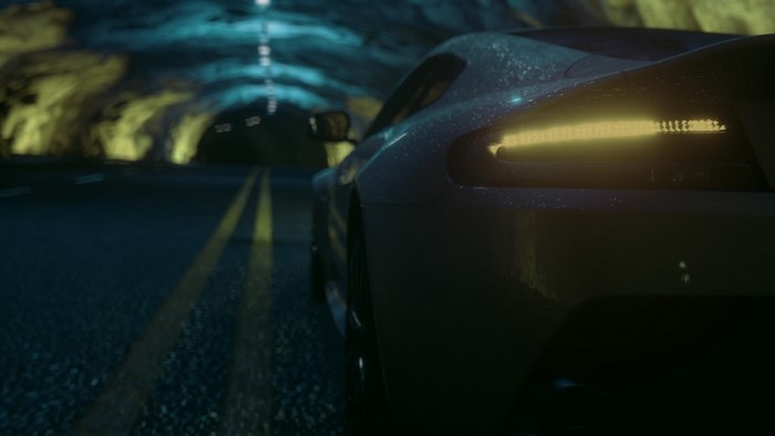 Aston Martin driving through a dark tunnel at night