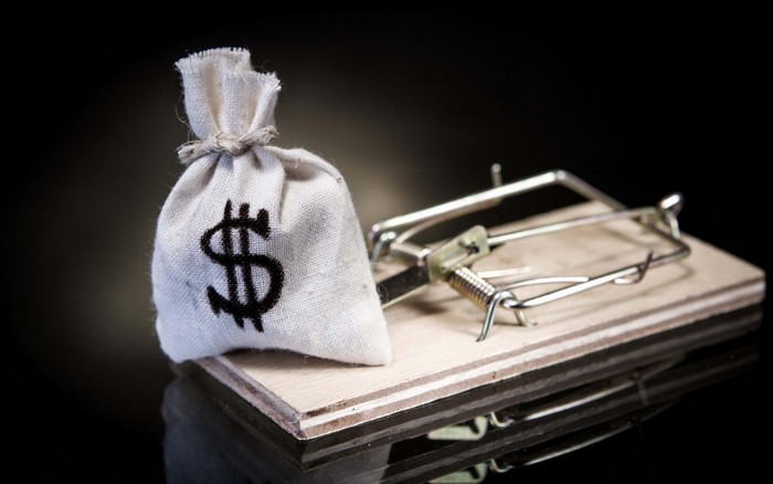 Money bag on a mousetrap