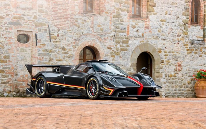 Pagani Zonda Revolucion supercar parked in front of stone building
