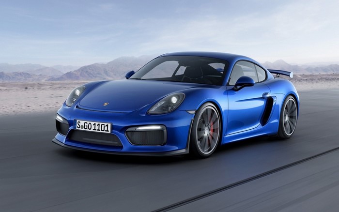 Blue Porsche Cayman GT4 on a road