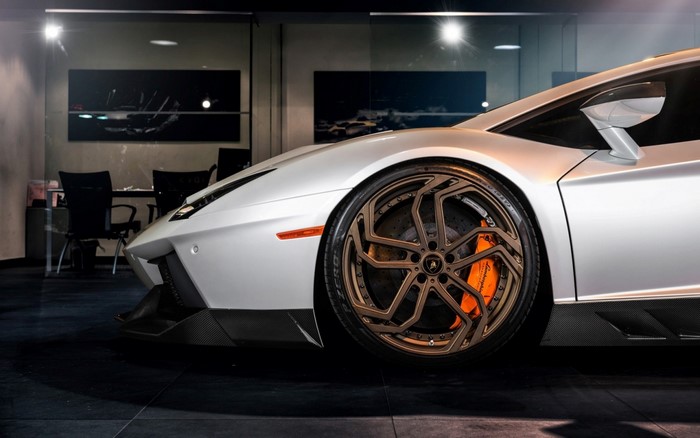 Lamborghini Aventador with custom bronze wheels and orange brake calipers