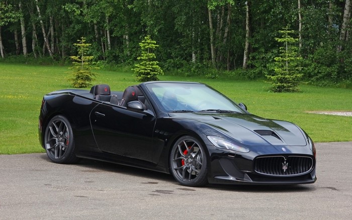 Black Maserati GranCabrio MC convertible parked on asphalt