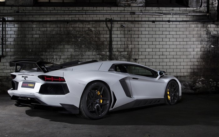 Novitec Torado Lamborghini Aventador in front of brick wall
