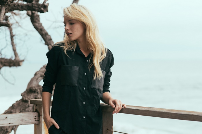 Rachel Yampolsky on a balcony overlooking the ocean