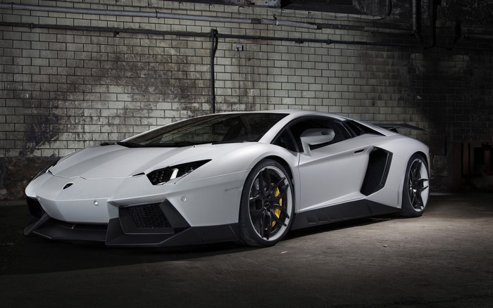 White Lamborghini Aventador parked in a garage