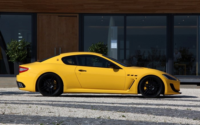 Yellow Maserati GranTurismo MC Stradale with black wheels