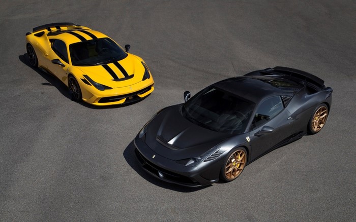 Two Ferrari 458 Speciale cars on asphalt