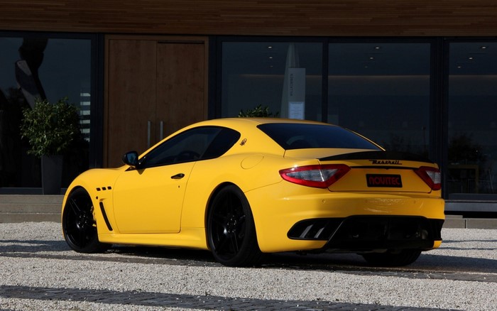 Yellow Maserati GranTurismo Novitec parked on gravel