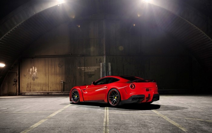 Red Ferrari F12berlinetta N Largo in a Hangar