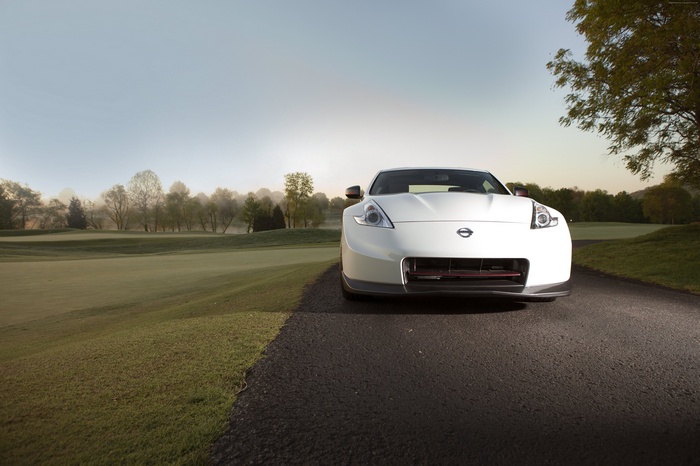White Nissan 370Z NISMO on a Golf Course