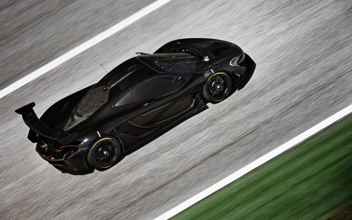 Black McLaren P1 GTR driving on a race track