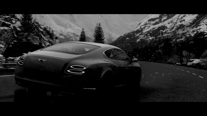 Bentley Continental GT driving on a snowy mountain road