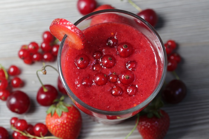 Red berry smoothie with strawberries and cherries