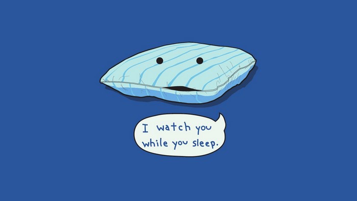 Cartoon pillow saying "I watch you while you sleep"