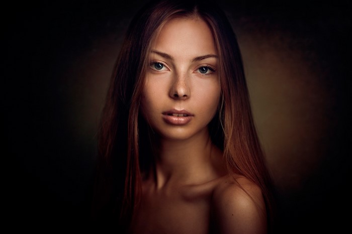 Portrait of a young woman with long brown hair