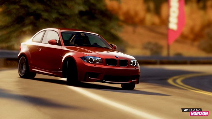 Red BMW M Coupe on a winding road in Forza Horizon