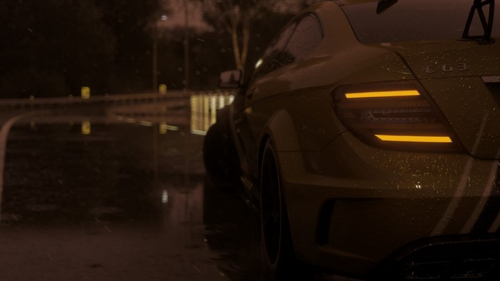 Yellow Mercedes-Benz C63 AMG Coupe in the rain