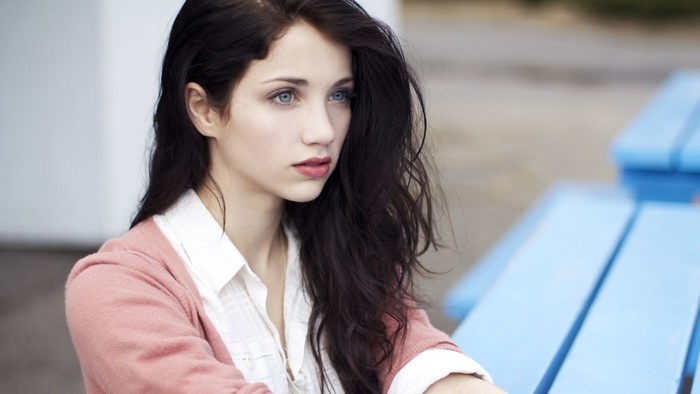 Portrait of a Woman with Blue Eyes and Long Hair