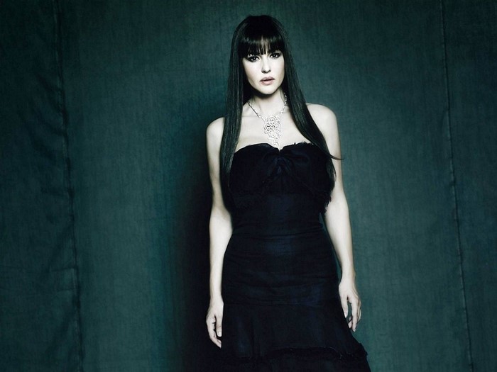 Monica Bellucci in a black dress and necklace