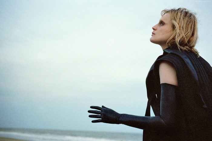 Guinevere Van Seenus on a beach