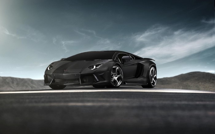 Black Lamborghini Aventador on a road