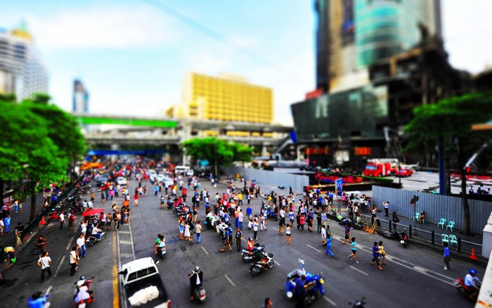 Crowded city street with pedestrians and vehicles