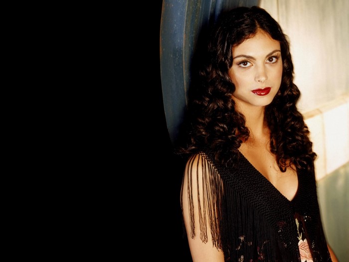 Morena Baccarin portrait with curly dark hair and black fringe shawl