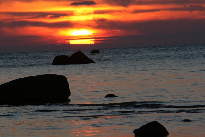 Sunset over the sea with rocks
