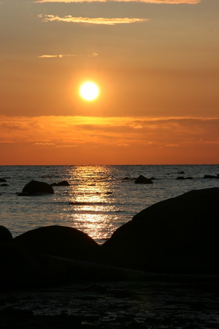 Sunset over the sea with rocks