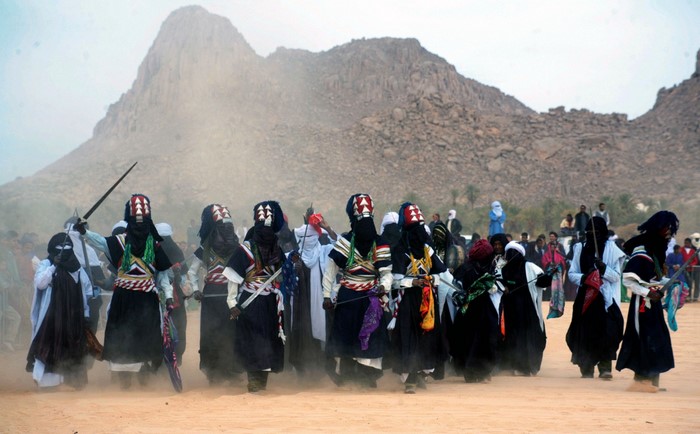 Touareg people performing a traditional dance in Algeria