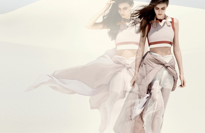 Model Auguste Abeliunaite in a desert with flowing fabric