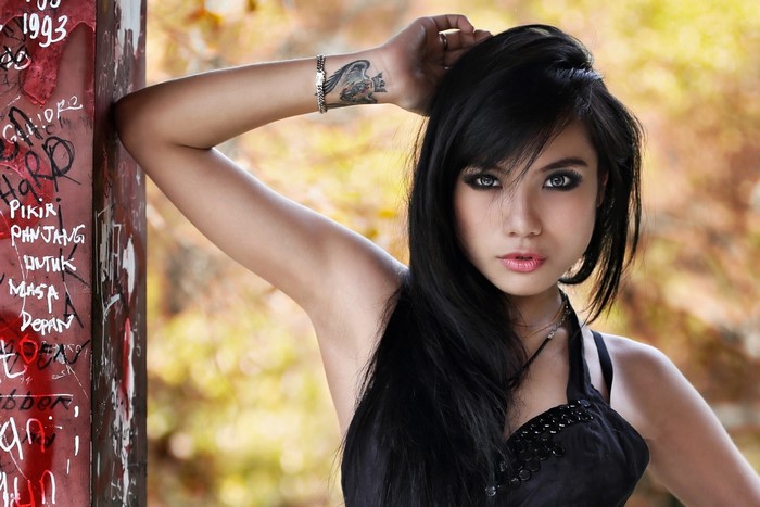 Portrait of Woman with Long Black Hair and Smoky Eyes