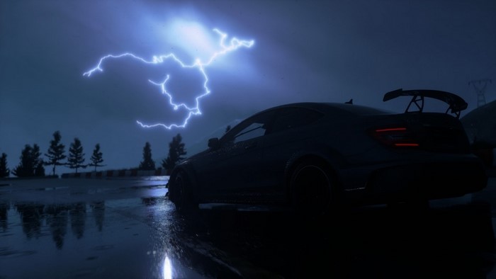 Sports car in a thunderstorm at night