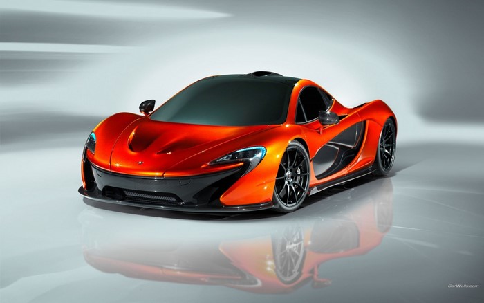 Orange McLaren P1 Hypercar on a reflective surface