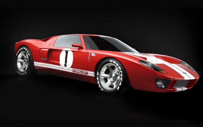 Red Ford GT race car with white stripes and number 1