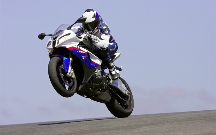 BMW S 1000 RR motorcycle performing a wheelie