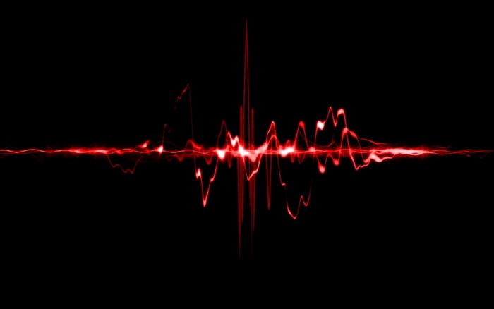 Abstract red sound wave on black background